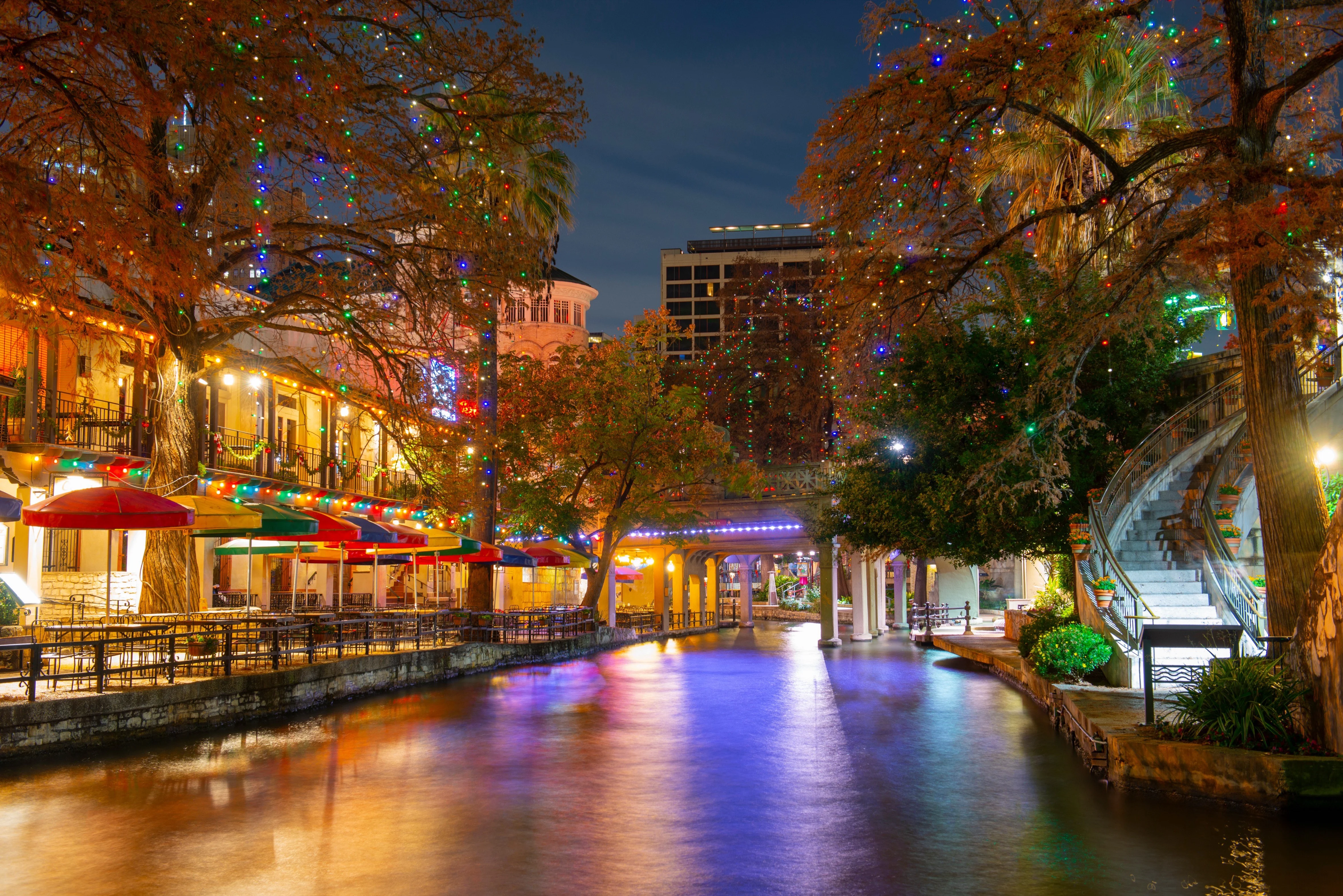 San Antonio River Walk and Stone Bridge Over San Antonio River Near Alamo in Downtown San Antonio, Texas, USA.